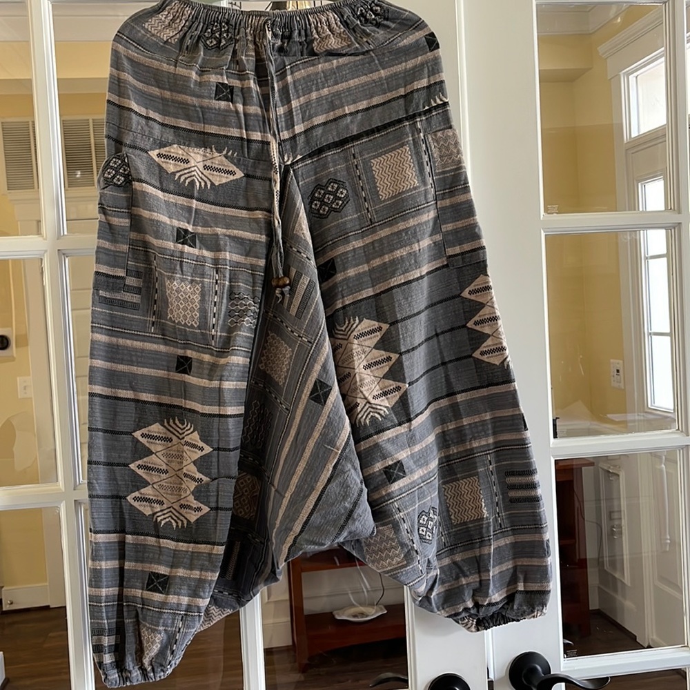 Unique women’s pants. New without tags. Size small. Baggy. Short length.